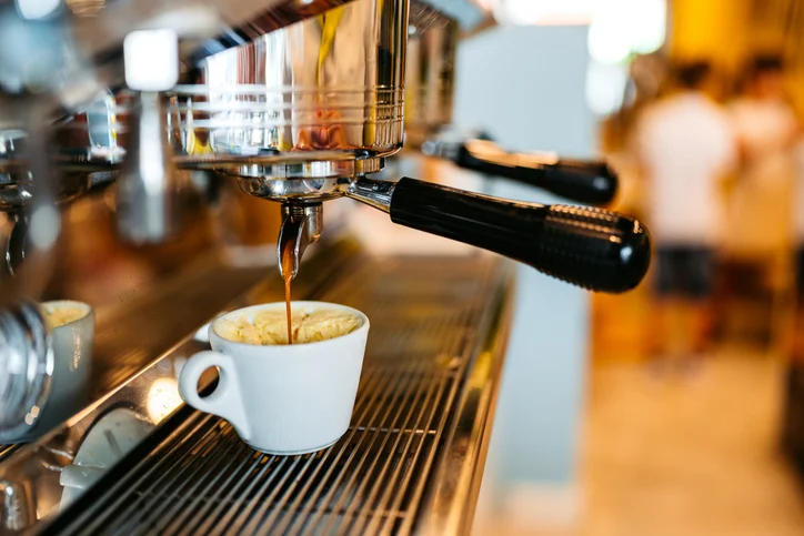 Coffee Being Poured In A Cup In A Coffee Shop